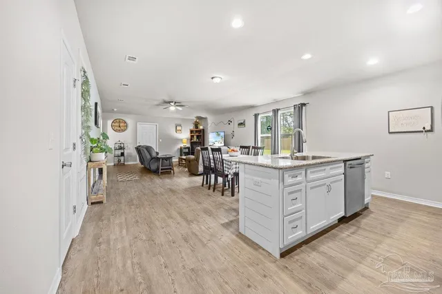 a kitchen with stainless steel appliances granite countertop a lot of counter top space