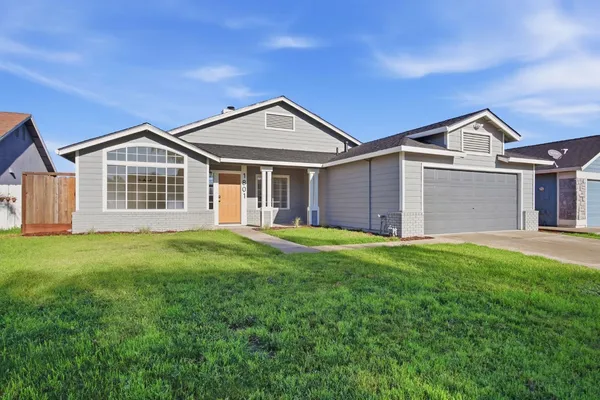 front view of a house with a yard