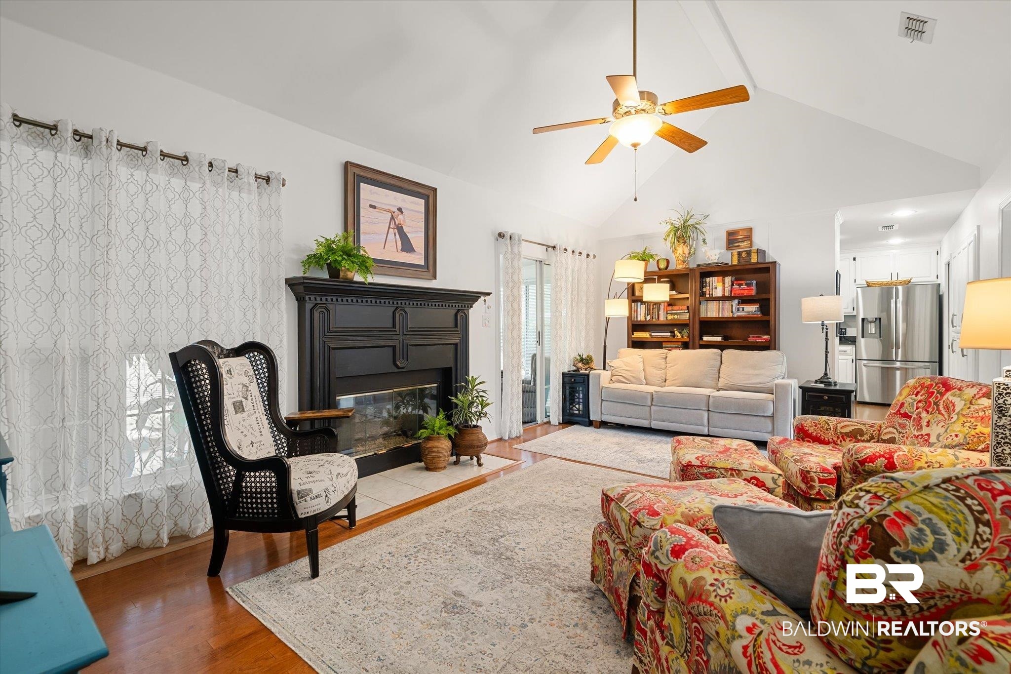 19924 Hunters Loop Fairhope, AL 36532 - Photo 13 of 40 Living room with beam ceiling, ceiling fan, high vaulted ceiling, and hardwood / wood-style flooring