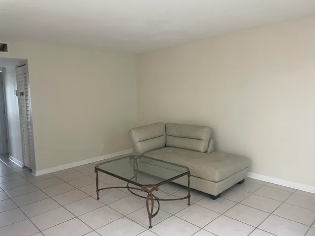 a living room with a couch and a table in it