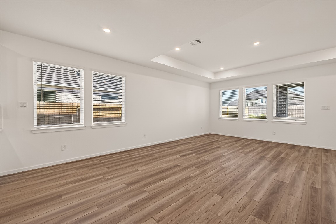 21926 Sam Raburn Drive Tomball, TX 77375 - Photo 11 of 47 a view of empty room with wooden floor and fan