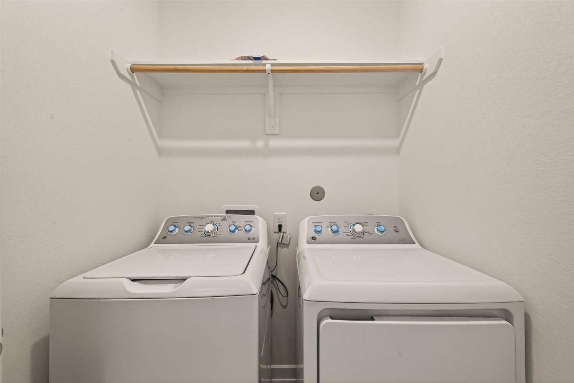 21926 Sam Raburn Drive Tomball, TX 77375 - Photo 17 of 47 a utility room with dryer and washer