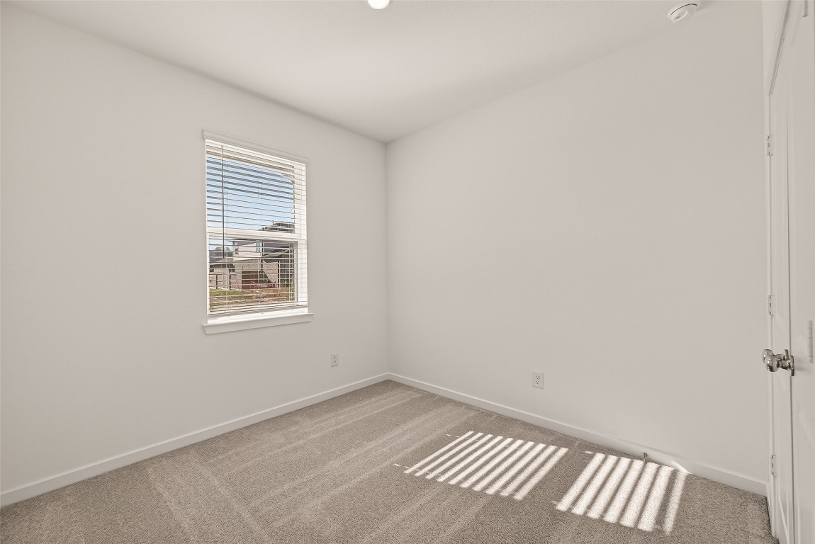 21926 Sam Raburn Drive Tomball, TX 77375 - Photo 18 of 47 a view of an empty room with a window