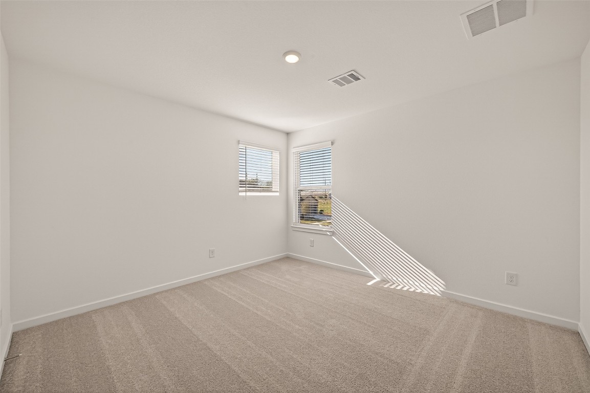 21926 Sam Raburn Drive Tomball, TX 77375 - Photo 24 of 47 an empty room with windows