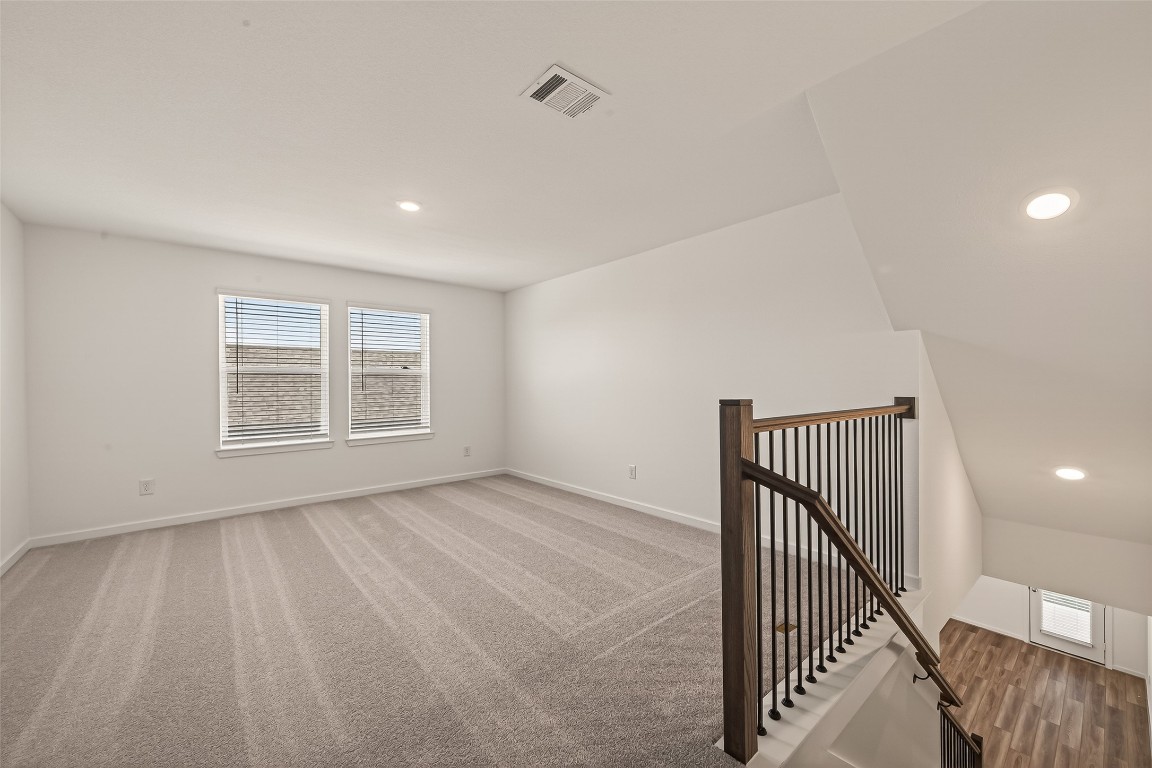 21926 Sam Raburn Drive Tomball, TX 77375 - Photo 29 of 47 a view of an empty room with wooden floor and a window
