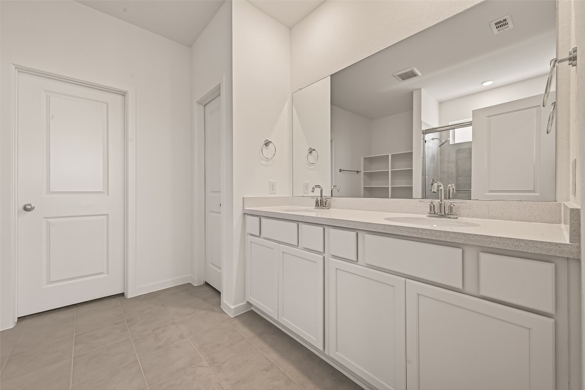 21926 Sam Raburn Drive Tomball, TX 77375 - Photo 36 of 47 a bathroom with a sink and a mirror