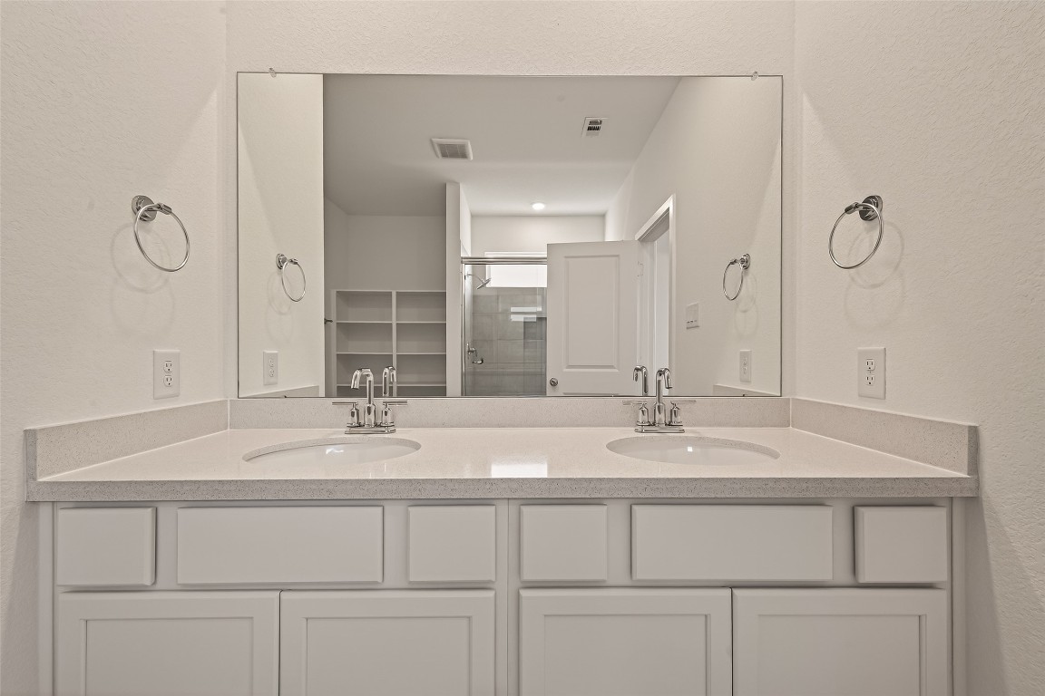 21926 Sam Raburn Drive Tomball, TX 77375 - Photo 37 of 47 a bathroom with a sink and a mirror