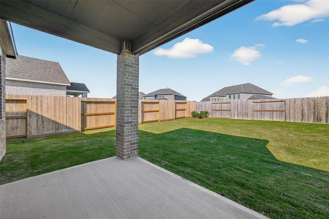 21926 Sam Raburn Drive Tomball, TX 77375 - Photo 41 of 47 a front view of house with yard and green space