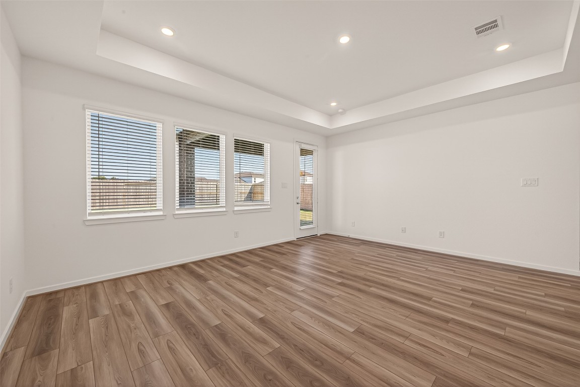 21926 Sam Raburn Drive Tomball, TX 77375 - Photo 9 of 47 a view of empty room with wooden floor and fan