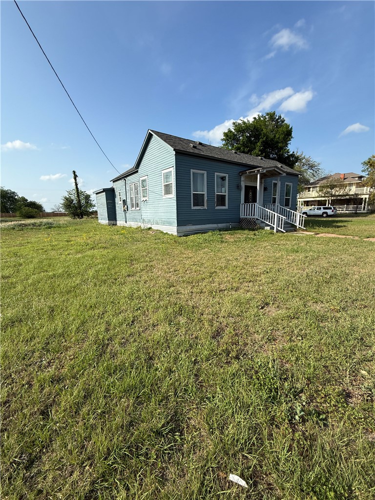 507 Logan Street Calvert, TX 77837 - Photo 1 of 19 a front view of a house with a yard