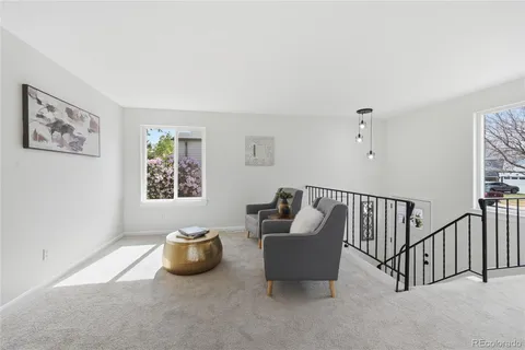 a view of a livingroom with furniture and windows