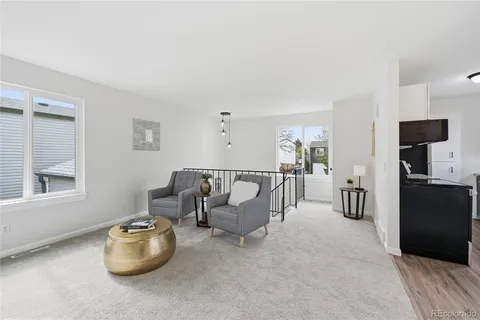 a hallway with furniture and a window
