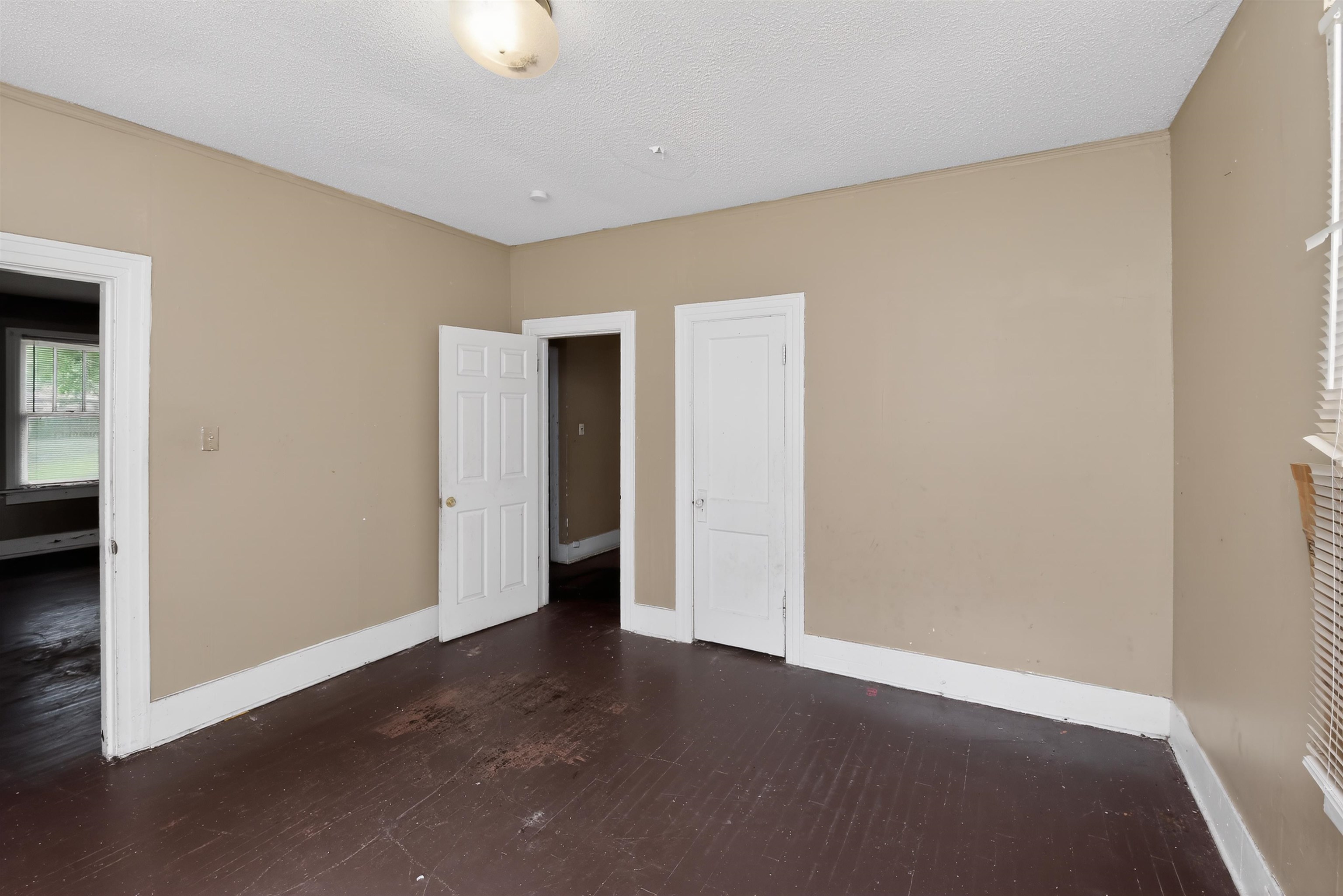 810 Hale Road Memphis, TN 38116 - Photo 21 of 30 Interior room featuring neutral wall tones, white trim, and dark wood-finish flooring