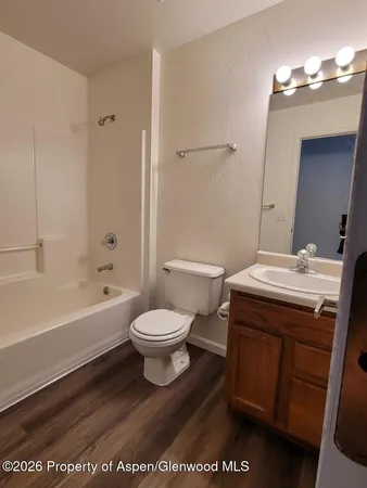 a bathroom with a sink a toilet and a bathtub