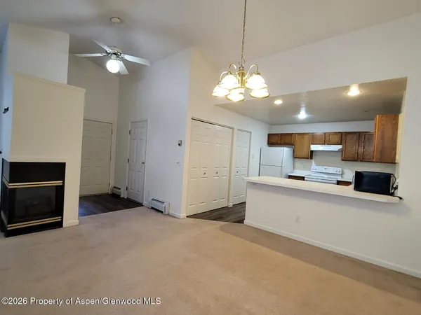 a view of a kitchen with a sink and dishwasher cabinets
