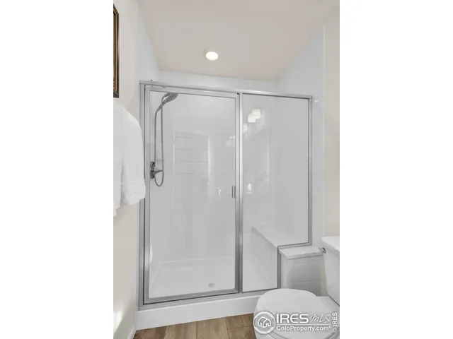 a bathroom with a glass shower door