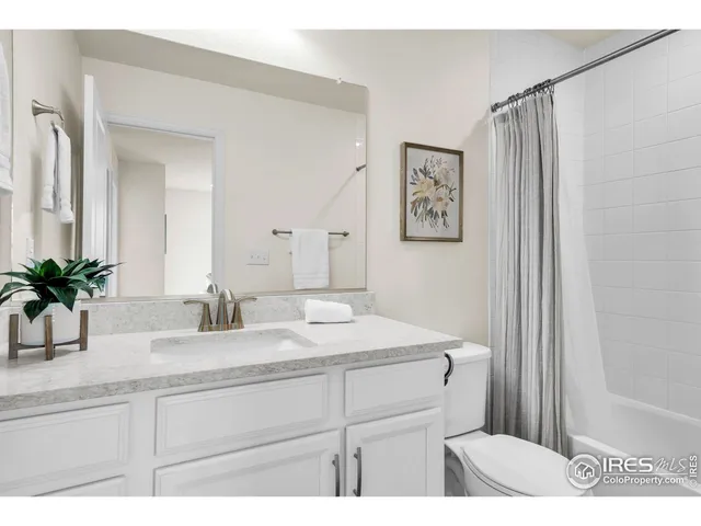 a bathroom with a sink a mirror and a toilet