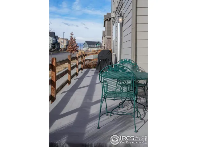 a view of a room with a table and chairs