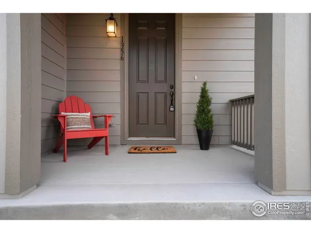 a backyard of a house with oven and potted plants