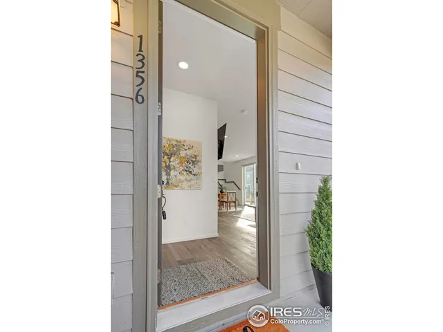 a view of a hallway with floor to ceiling window