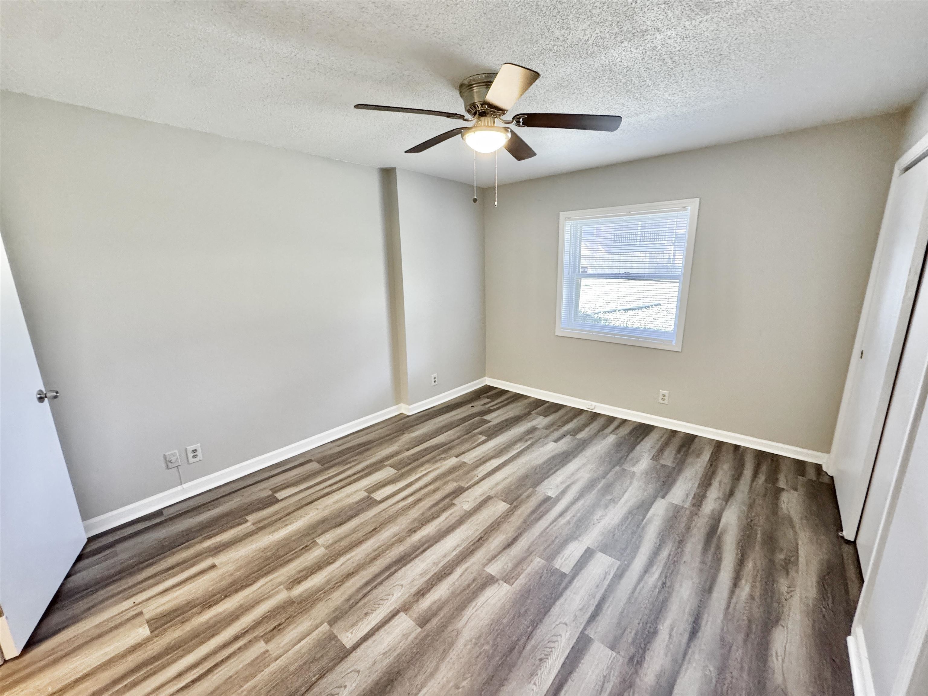 1202 Middle Court, Unit 101 Memphis, TN 38119 - Photo 11 of 24 a view of room with window and ceiling fan