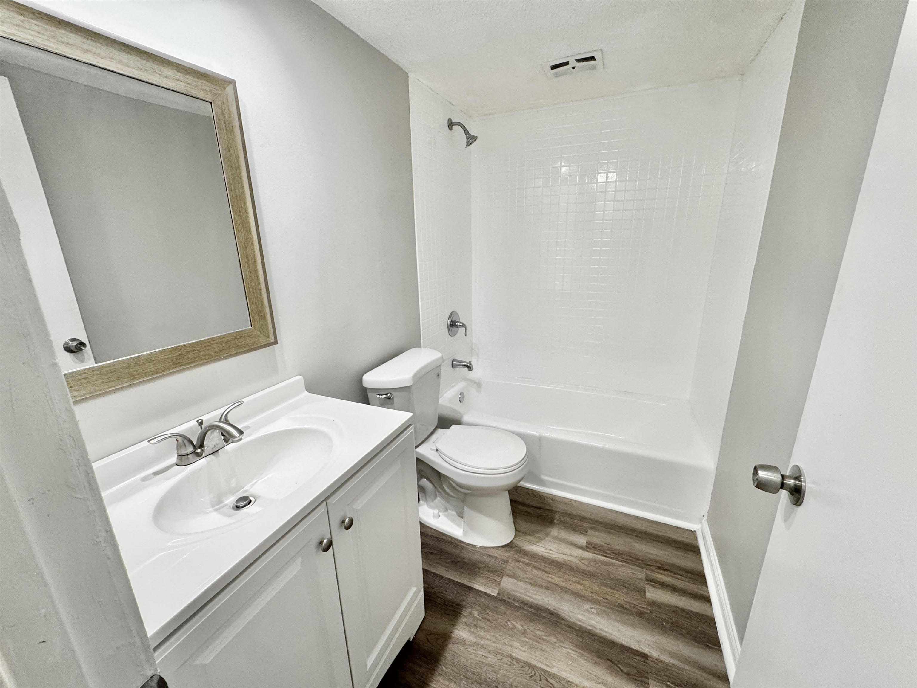 1202 Middle Court, Unit 101 Memphis, TN 38119 - Photo 12 of 24 a bathroom with a sink a toilet and shower