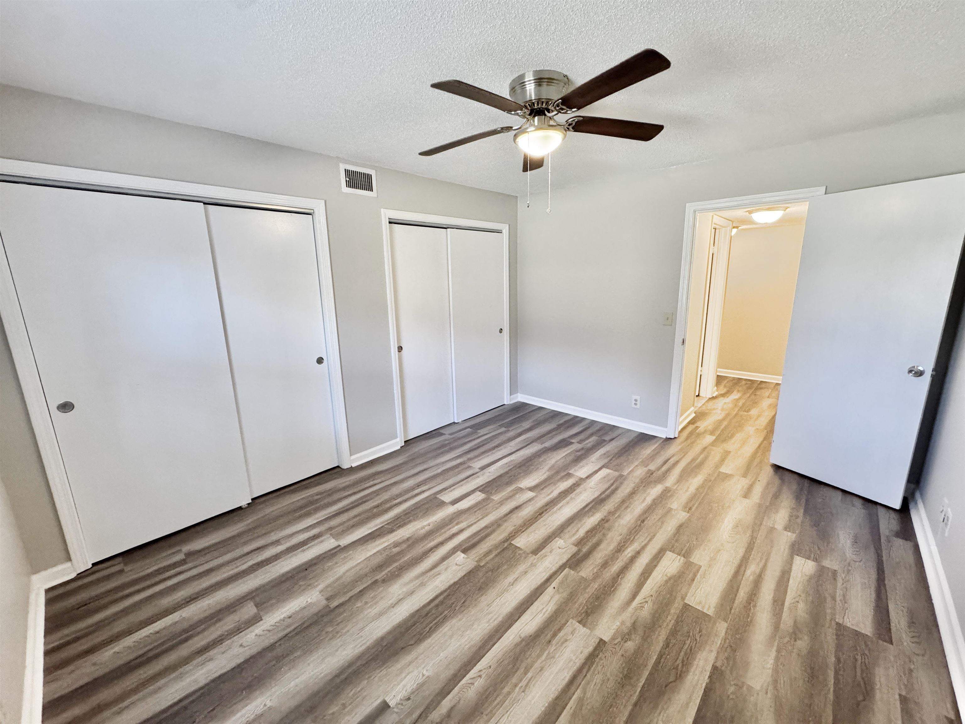 1202 Middle Court, Unit 101 Memphis, TN 38119 - Photo 13 of 24 a view of a livingroom with wooden floor