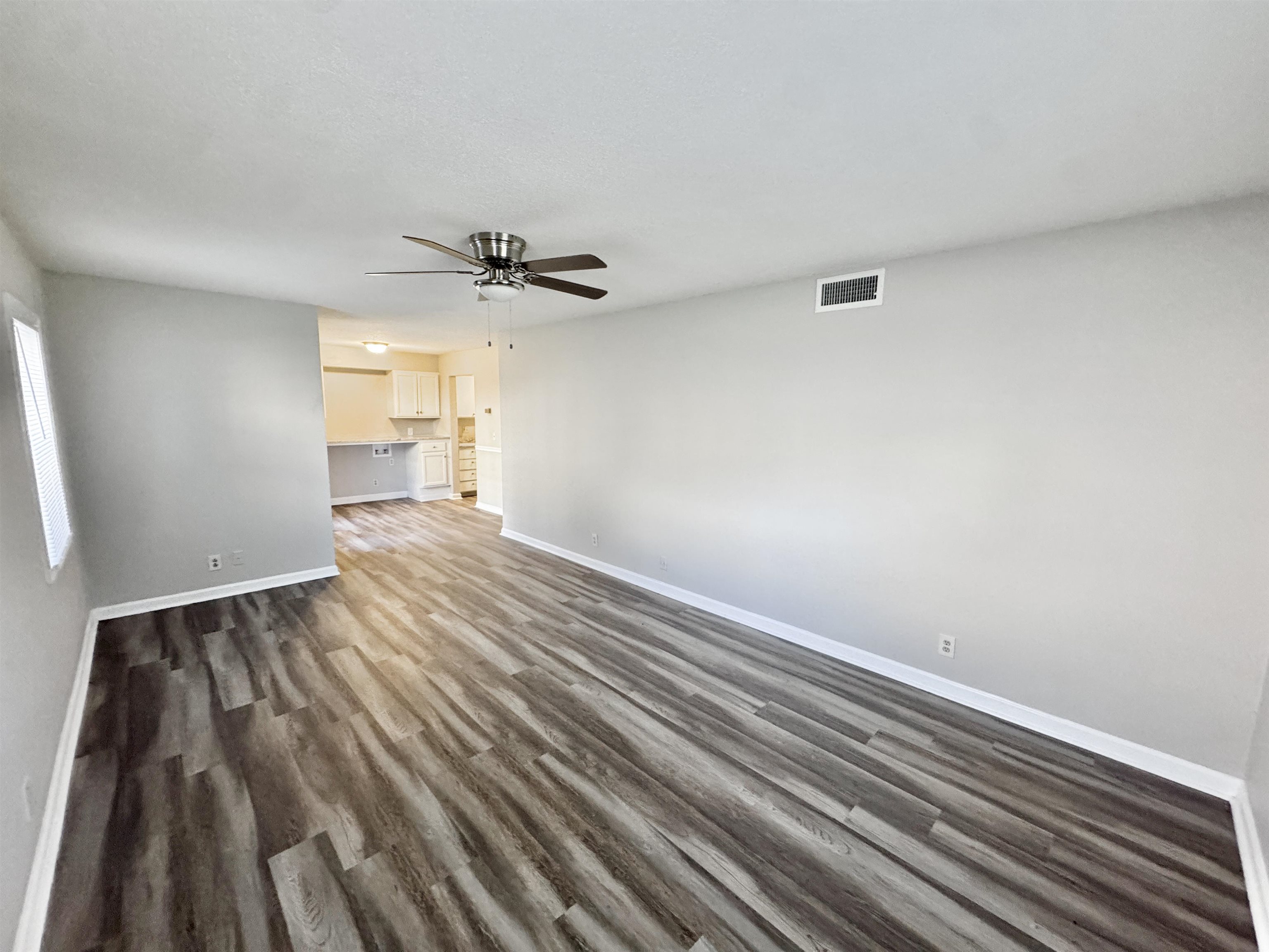 1202 Middle Court, Unit 101 Memphis, TN 38119 - Photo 9 of 24 wooden floor in an empty room