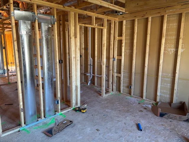 a bathroom with a shower and a sink
