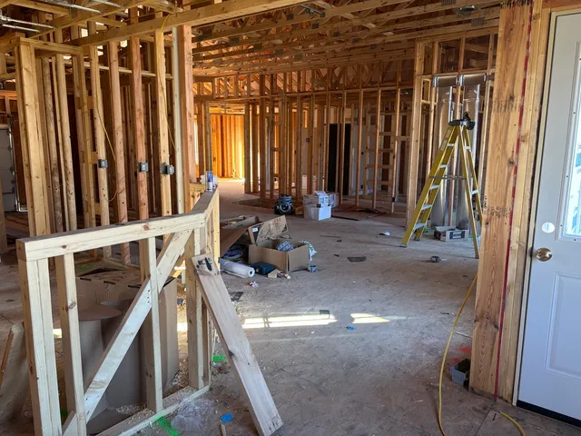 a view of a room with wooden floor and a window