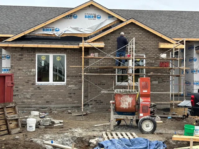 a front view of a house with sitting area
