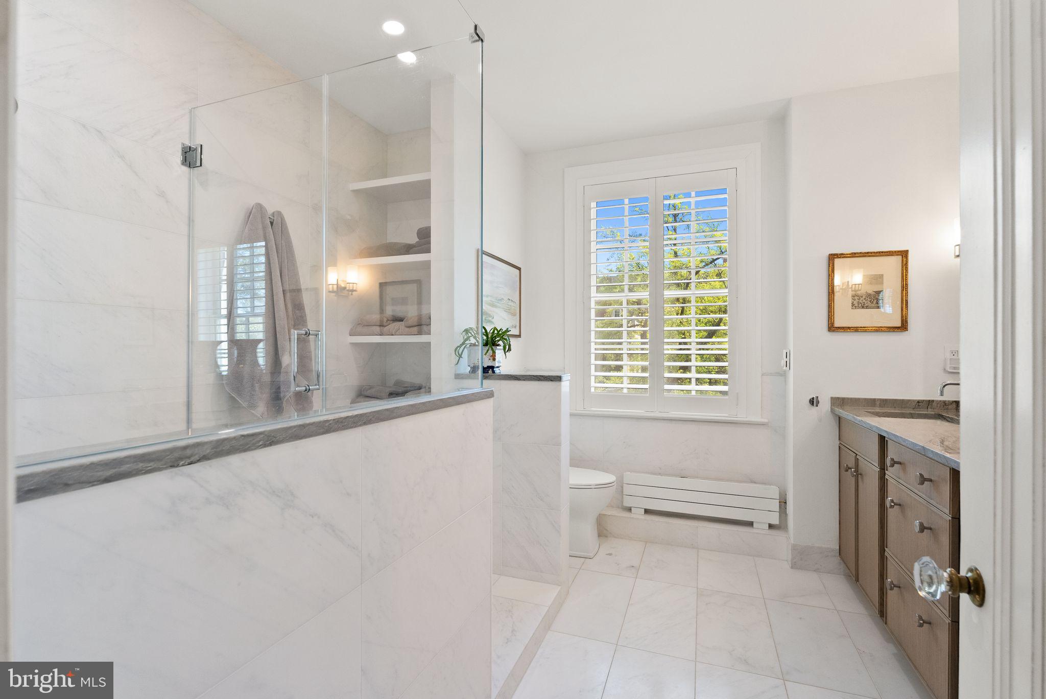 1661 Crescent Place Northwest, Unit 305 Washington, DC 20009 - Photo 17 of 25 a bathroom with a bathtub and a sink