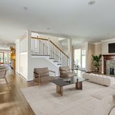 a living room with fireplace furniture and a flat screen tv