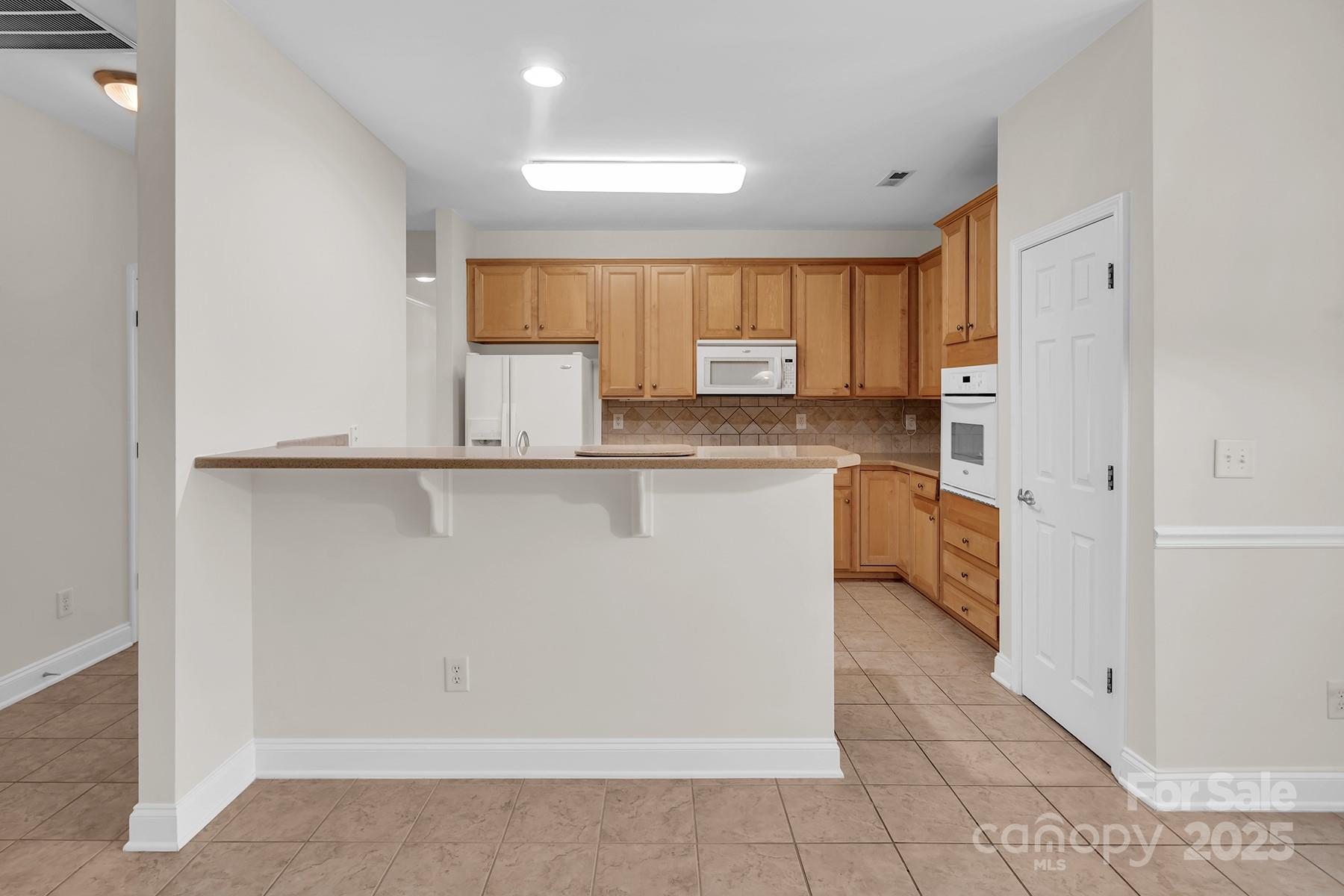 923 Platinum Drive Fort Mill, SC 29708 - Photo 12 of 34 a kitchen with stainless steel appliances granite countertop a refrigerator and a sink