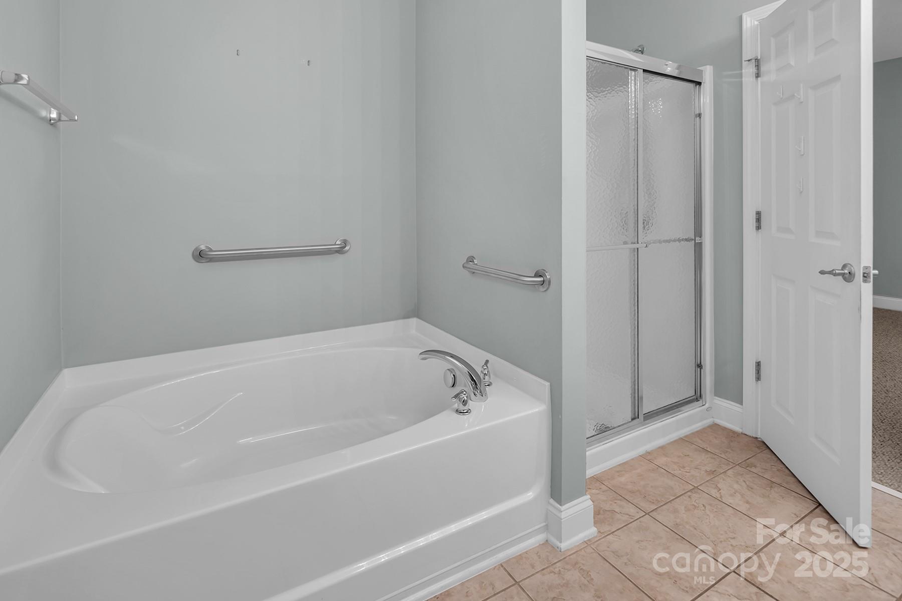 923 Platinum Drive Fort Mill, SC 29708 - Photo 22 of 34 a white bath tub sitting in a bathroom