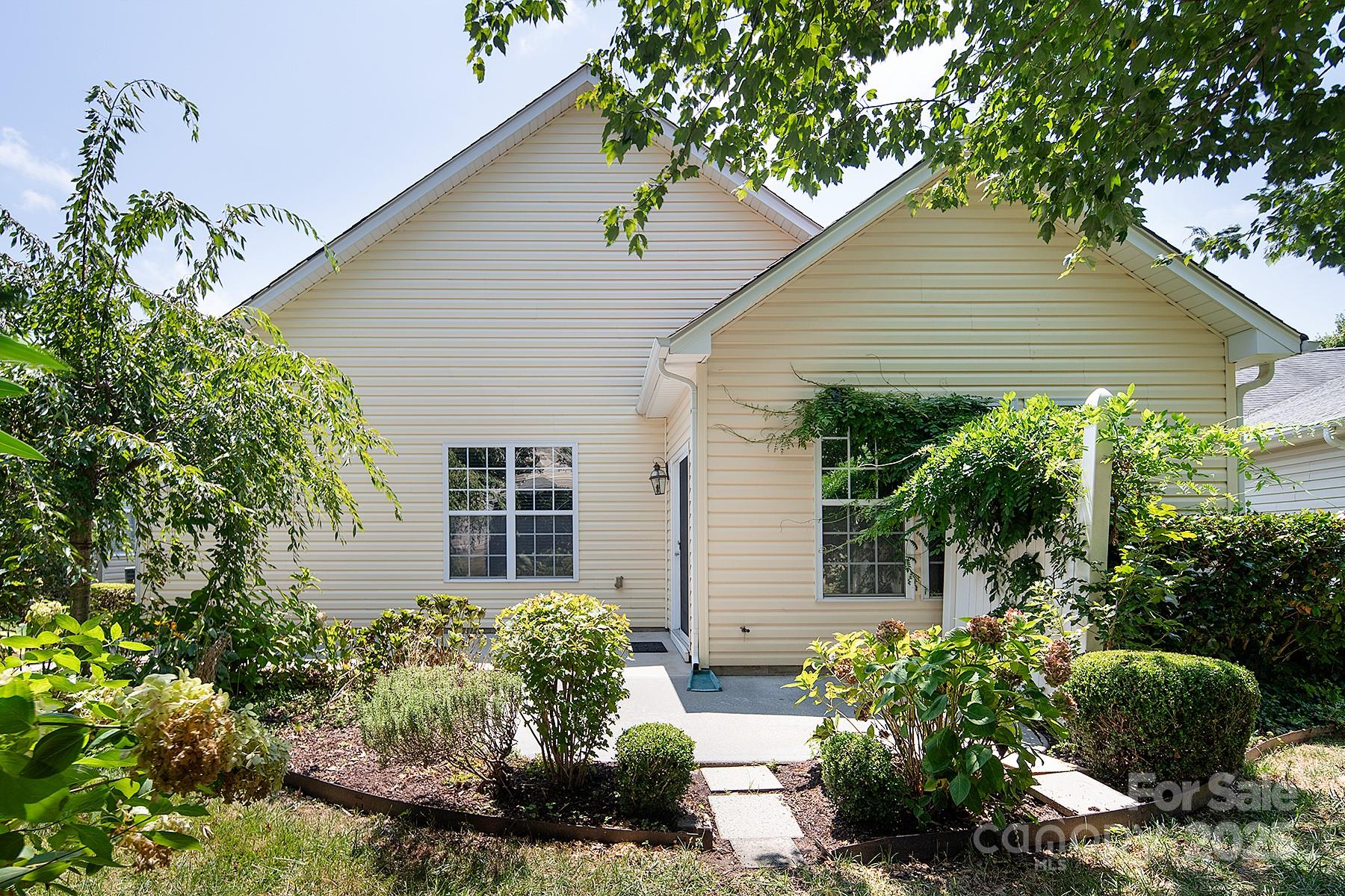 923 Platinum Drive Fort Mill, SC 29708 - Photo 32 of 34 a front view of a house with garden