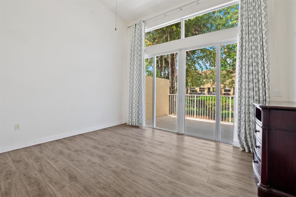 816 West Village Circle, Unit 1 Davie, FL 33325 - Photo 12 of 27 a view of a big room with wooden floor and windows