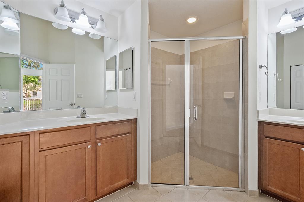 816 West Village Circle, Unit 1 Davie, FL 33325 - Photo 14 of 27 a bathroom with a shower a sink and a mirror
