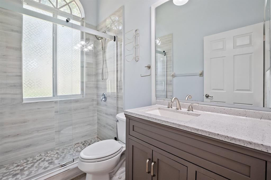 816 West Village Circle, Unit 1 Davie, FL 33325 - Photo 17 of 27 a bathroom with a sink a toilet and shower