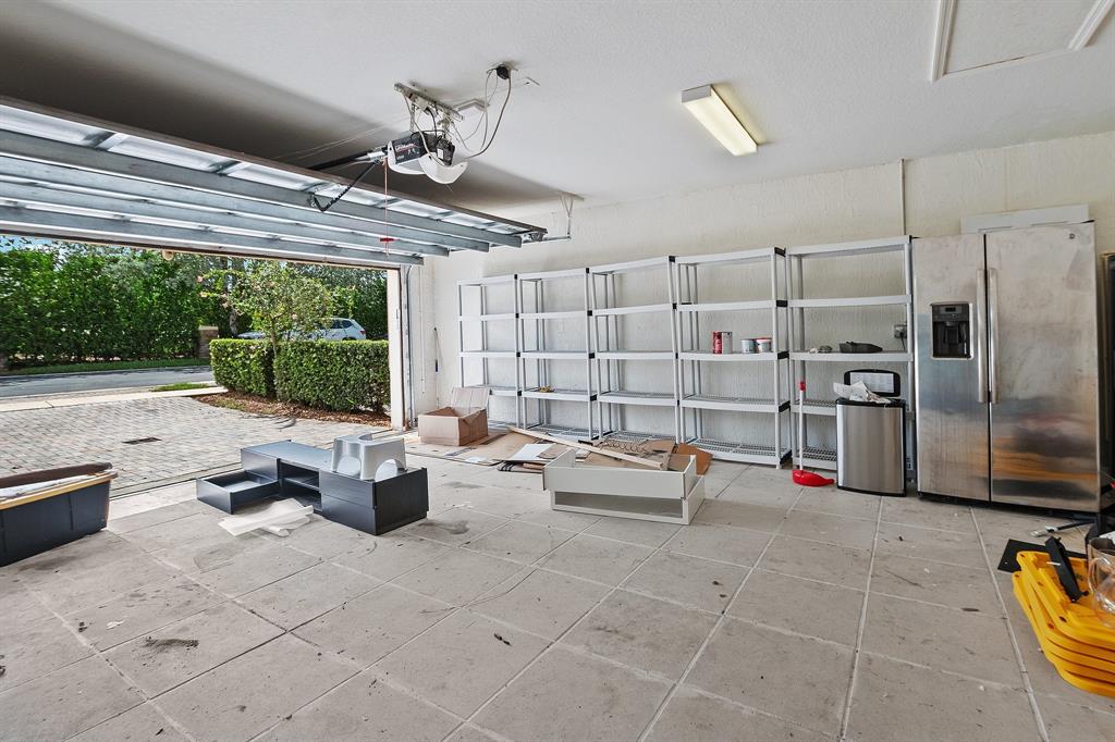 816 West Village Circle, Unit 1 Davie, FL 33325 - Photo 20 of 27 a living room with lots of furniture and a chandelier