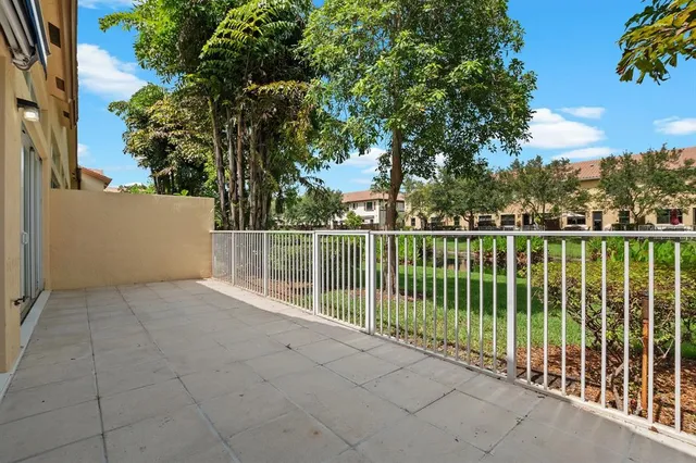 a view of a wrought iron fences in front of house