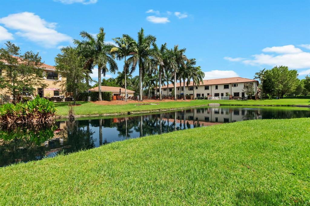 816 West Village Circle, Unit 1 Davie, FL 33325 - Photo 23 of 27 a view of a house with a yard and sitting area