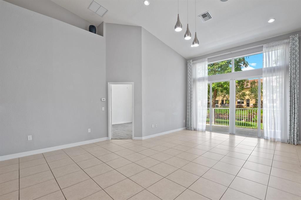 816 West Village Circle, Unit 1 Davie, FL 33325 - Photo 8 of 27 a view of an empty room with a window