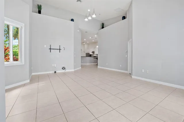 a view of an empty room and a window