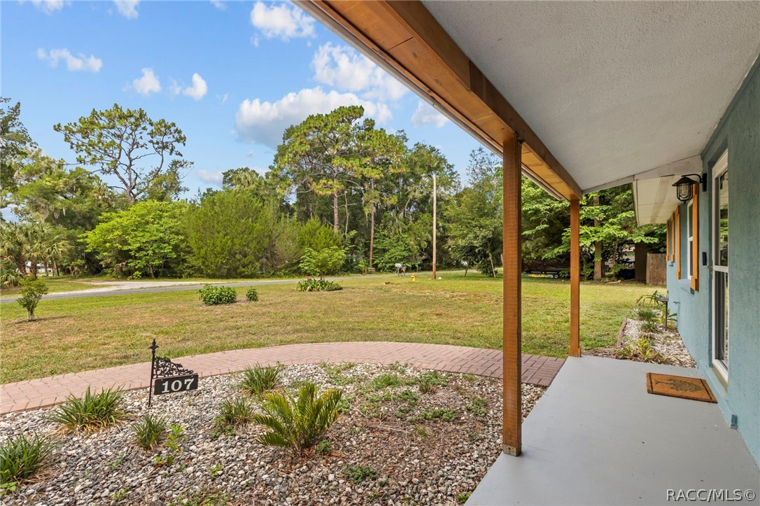 107 Allen Avenue Inglis, FL 34449 - Photo 4 of 36 a view of a swimming pool with a patio