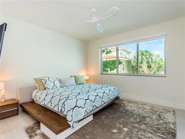 a bedroom with a bed and window
