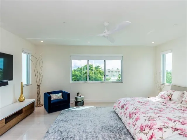 a bedroom with a bed and a couch