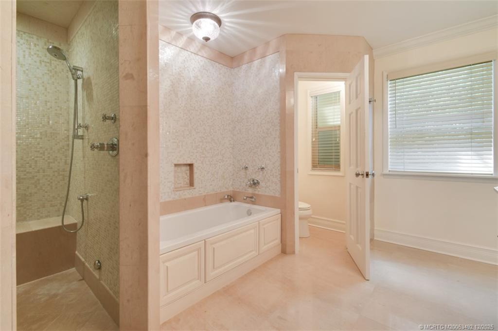 229 Colony Road Jupiter, FL 33469 - Photo 14 of 52 a bathroom with a tub shower and sink