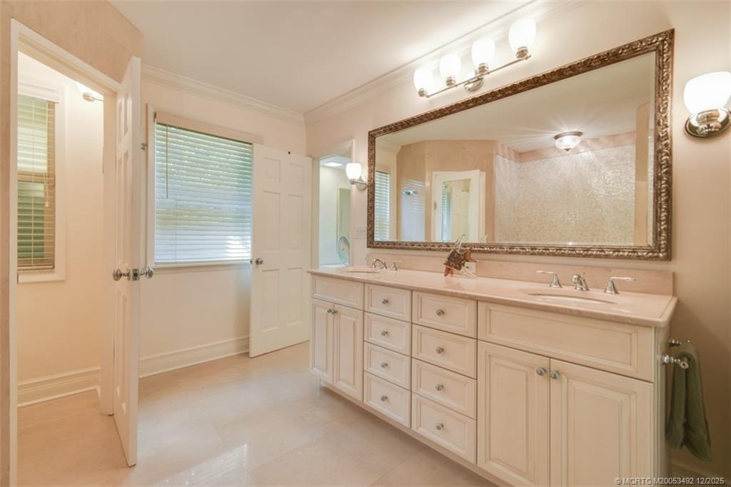 229 Colony Road Jupiter, FL 33469 - Photo 15 of 52 a spacious bathroom with double sink and a mirror