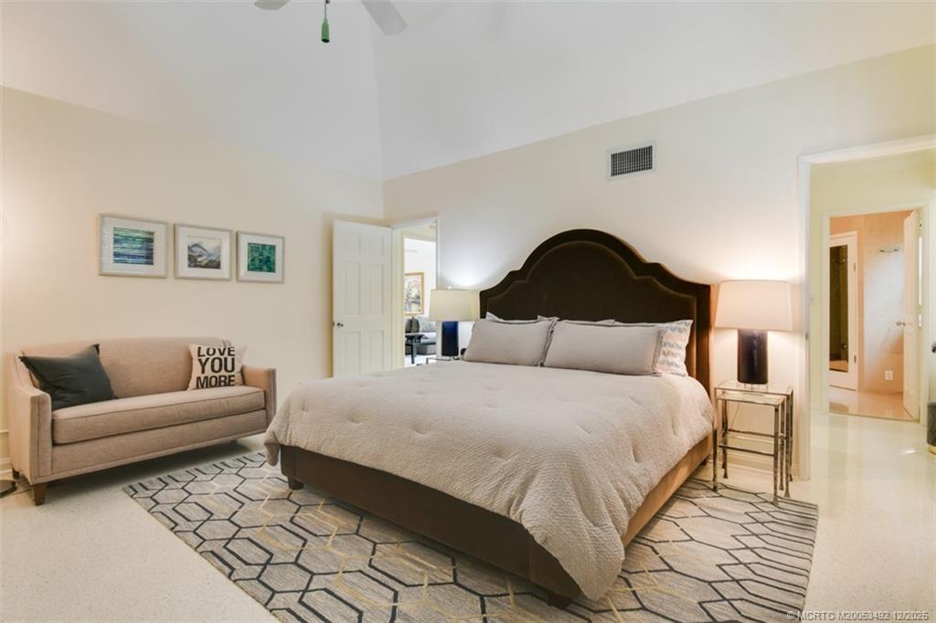 229 Colony Road Jupiter, FL 33469 - Photo 18 of 52 a bedroom with a bed and a couch